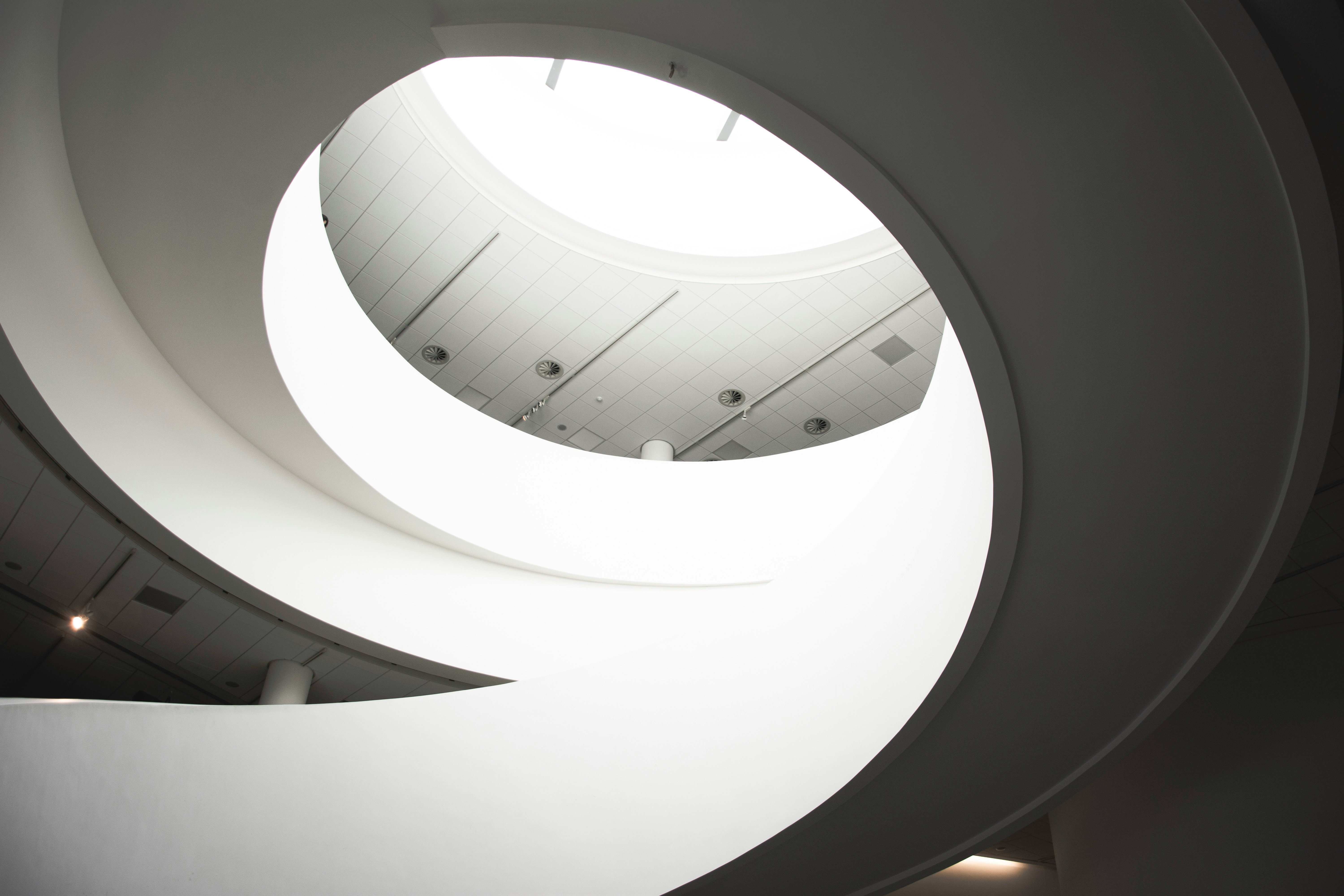 white spiral stairs with white ceiling